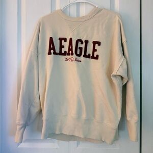 American Eagle Cream Pullover Sweatshirt with Maroon Lettering